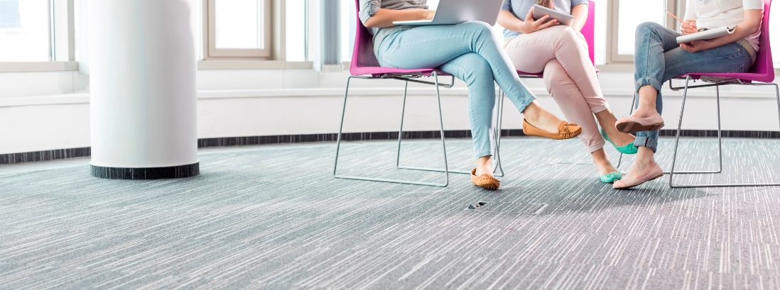 Low section of businesswomen working in creative office